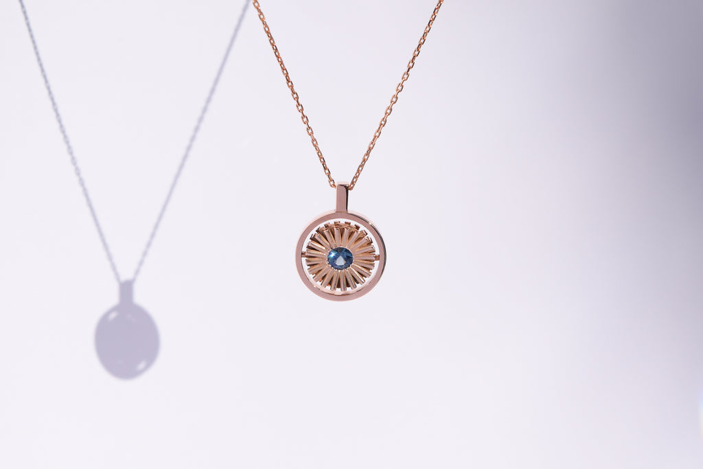 SPINNING SUN NECKLACE TEAL SAPPHIRE